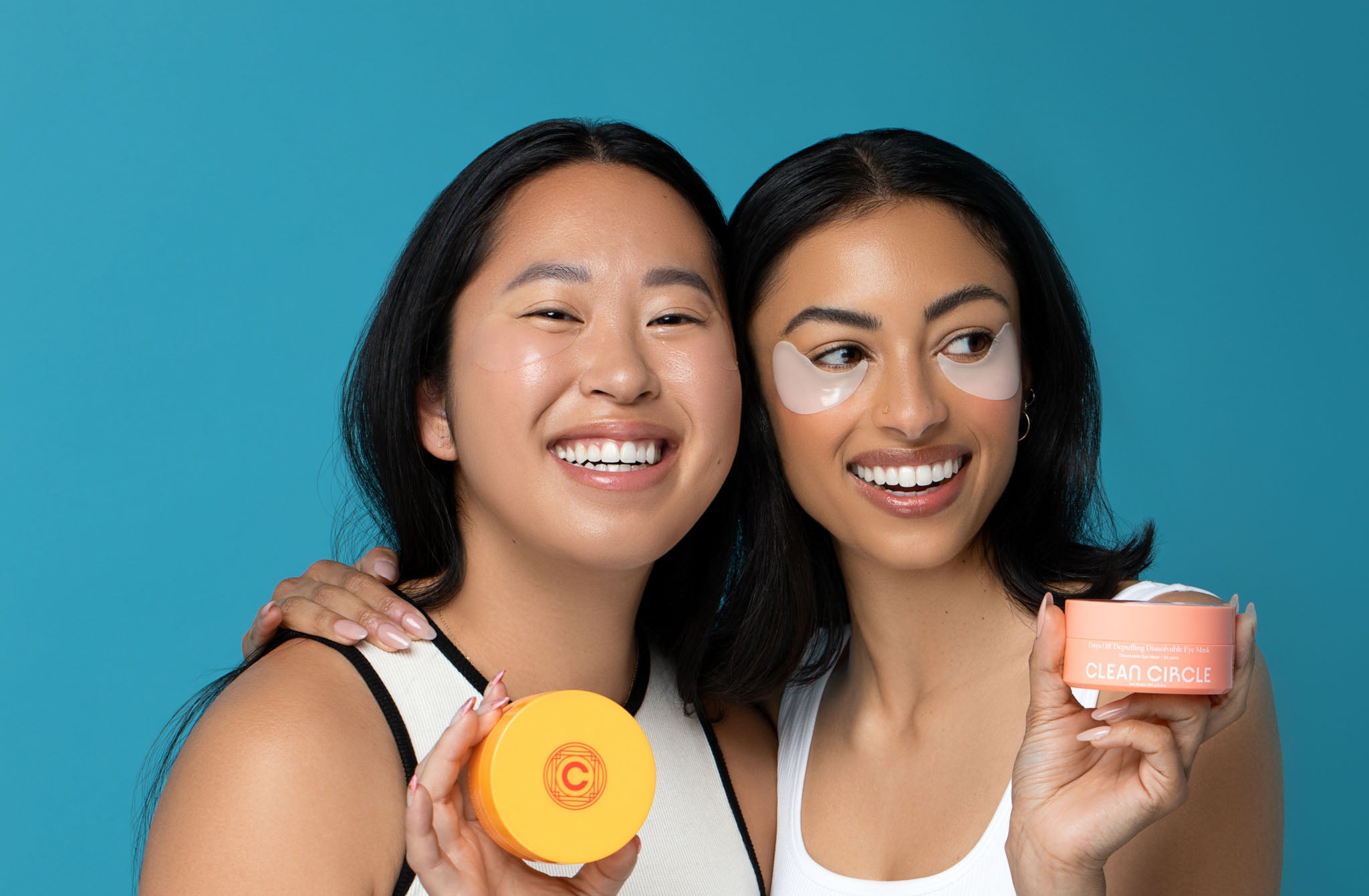 clean circle two female models showing wearing dissolvable eye masks and holding packaging